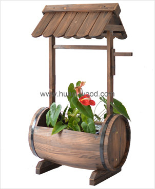 wooden barrel planter with roof